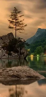 Serene lake and mountains mobile wallpaper with reflective waters.