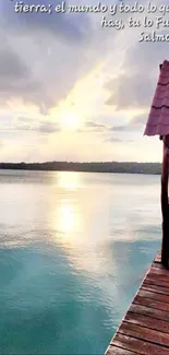 Serene lake with dock and sunset sky.