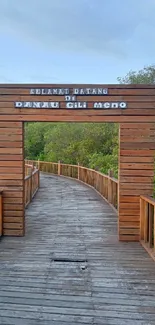 Lakeside boardwalk at Danau Gili Meno in a serene natural setting.