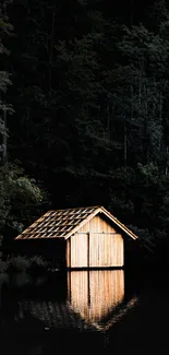 Mobile wallpaper of a lakeside cabin reflecting in calm waters.