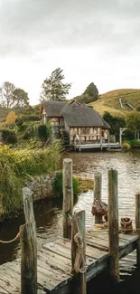 Tranquil lakeside cottage view with wooden dock and lush greenery.