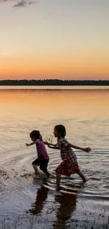 Children playing in a serene lakeside sunset, capturing nature's warmth.