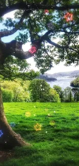 A peaceful landscape with a tree, lush greenery, and a serene river view.