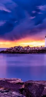 Serene lighthouse with vibrant purple sunset reflecting on the ocean.