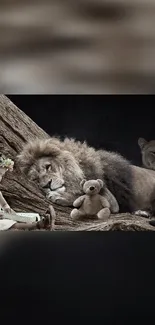 Sleeping lion beside teddy bear in woodland setting.