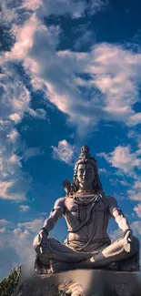 Peaceful Shiva statue under cloudy blue sky, perfect for spiritual decor.