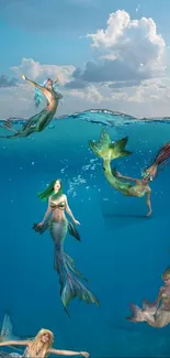 Mermaids swimming gracefully in a tranquil blue ocean scene.