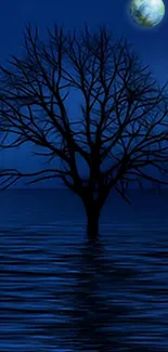 Midnight blue wallpaper with tree silhouette and serene water reflection.