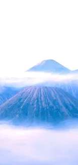 Serene misty mountain with blue hues.