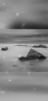 Monochrome seascape with rocks in gentle mist.