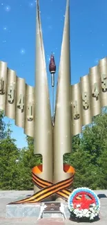 Monument surrounded by greenery under a clear blue sky.