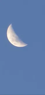 Crescent moon against a blue sky wallpaper.