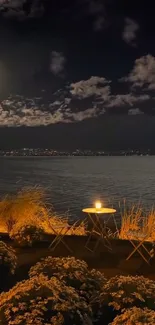 Moonlit lakeside view with candlelight and night sky.