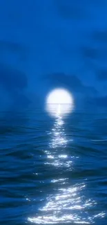 Moonlit ocean view with a serene, radiant blue seascape and a glowing moon.