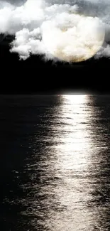 Serene moonlit ocean with reflection and clouds.