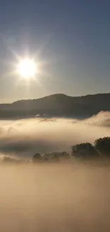 Sunrise over misty mountains with foggy scenery.