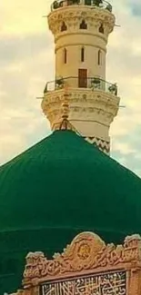 Serene green mosque dome with cloudy sky background.