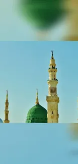 Serene mosque minarets against a blue sky.