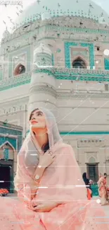 Woman admires mosque in serene setting.