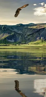 Eagle over reflective lake and mountains