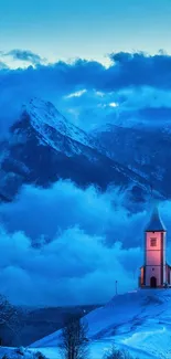 Snow-covered church with mountain and blue sky at dusk.