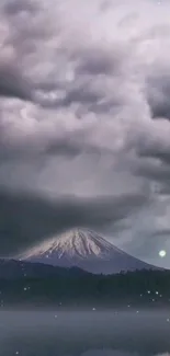 Majestic mountain with dramatic cloudy sky wallpaper.