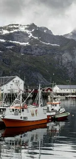 Serene harbor with boats and mountains.