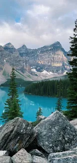 A turquoise lake with rocky mountain backdrop and pine trees.