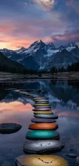 Serene lake with colorful stones and mountain view at sunset.