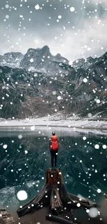 Person with backpack by a snowy mountain lake.