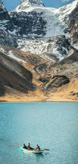 Scenic mountain lake with boat and snowy peaks.