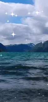 Tranquil mountain lake with sparkling reflections under a blue sky.