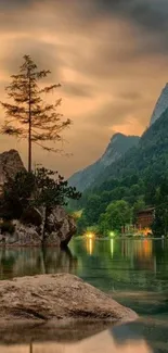 Serene mountain lake with forest and moody sky.