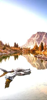 Serene mountain lake with reflecting peak and tranquil scenery.