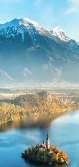 Serene mountain lake with an island church amidst autumn foliage.