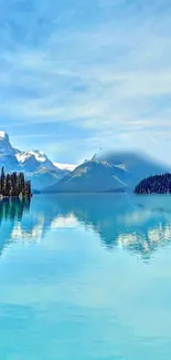 Tranquil mountain lake scene with blue sky.