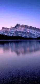 Sunset mountain reflecting over a serene lake.