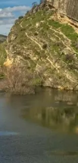 Serene mountain landscape reflected in calm lake.