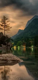 Serene mountain lake wallpaper with a lone tree and calming dusk atmosphere.