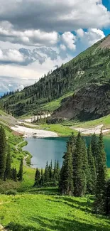 Serene mountain landscape with lake and greenery under a blue sky.