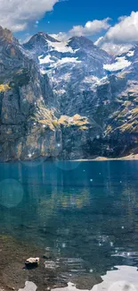 Scenic view of a tranquil mountain lake under a blue sky.