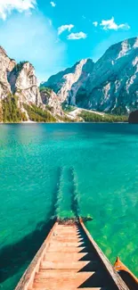 Serene mountain lake with vibrant cyan waters and clear skies.