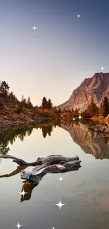 Serene mountain lake wallpaper with peaceful reflections and a rocky peak.