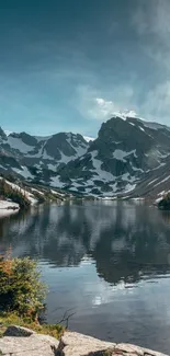 Scenic view of a tranquil mountain lake under a blue sky.