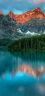 Serene mountain lake with reflections and vibrant sunset colors.