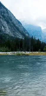 Peaceful mountain lake with forest and peaks.