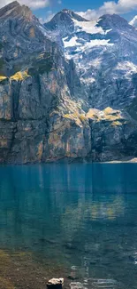 Serene mountain lake with rocky peaks and clear blue water.