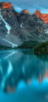 Serene mountain lake with turquoise water reflecting peaks.