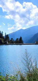 Serene mountain lake under a blue sky.