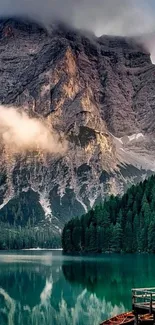 Scenic mountain lake with forest reflection and tranquil waters.